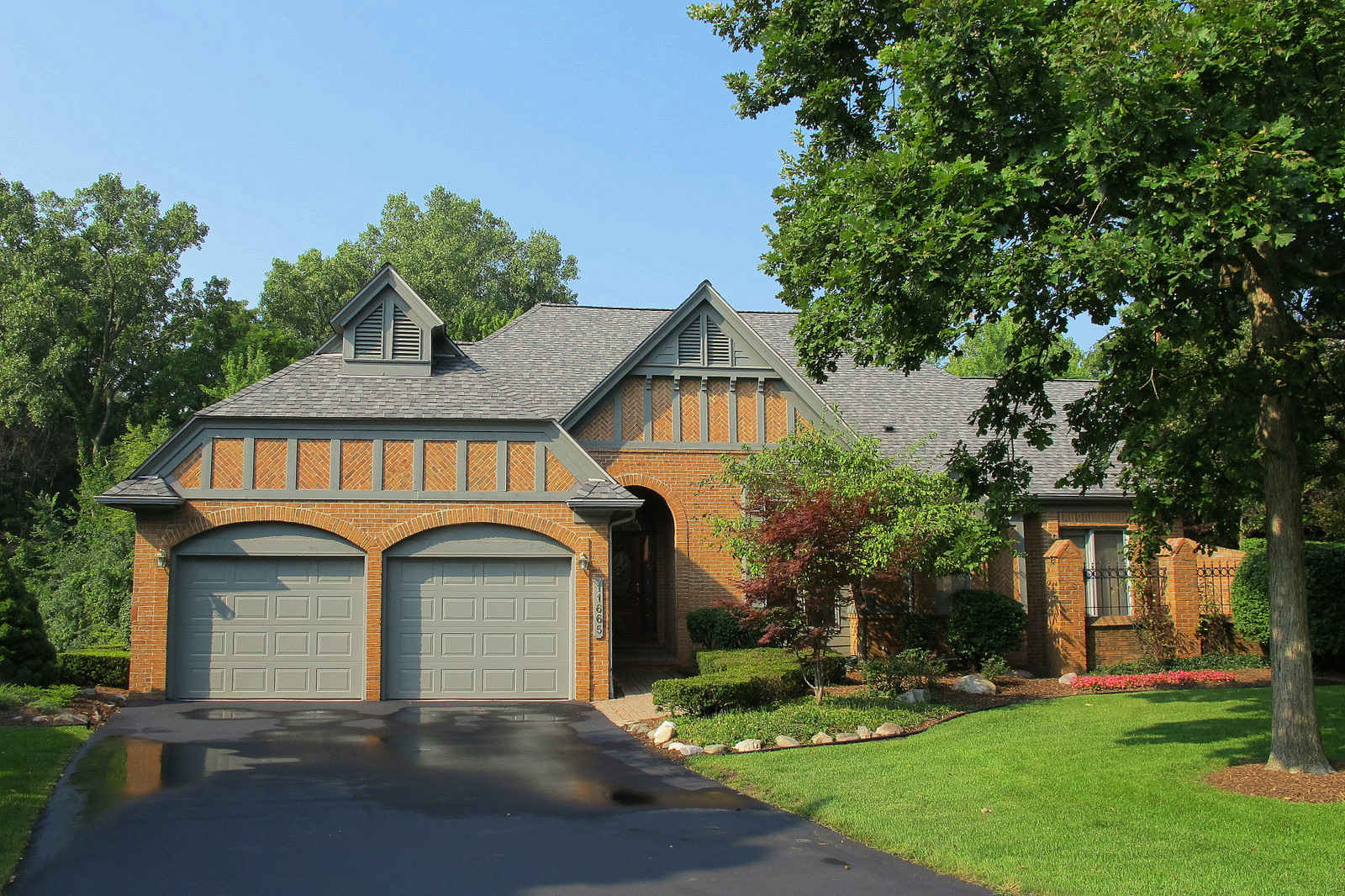 Just Listed! Ranch End Unit Condo in Gated Community with Pond Views